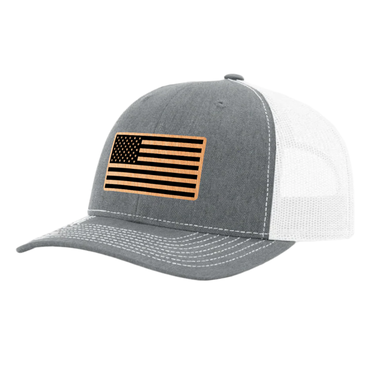 A heather gray and white trucker hat with a brushed copper acrylic patch on the front featuring an American flag design with black accents.