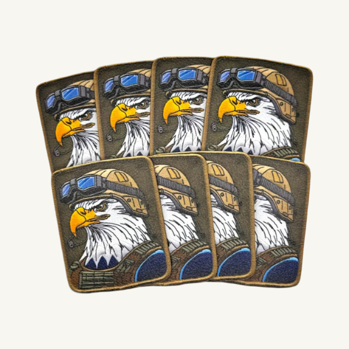 Multiple patches with a UV printed design of a bald eagle wearing a military helmet.