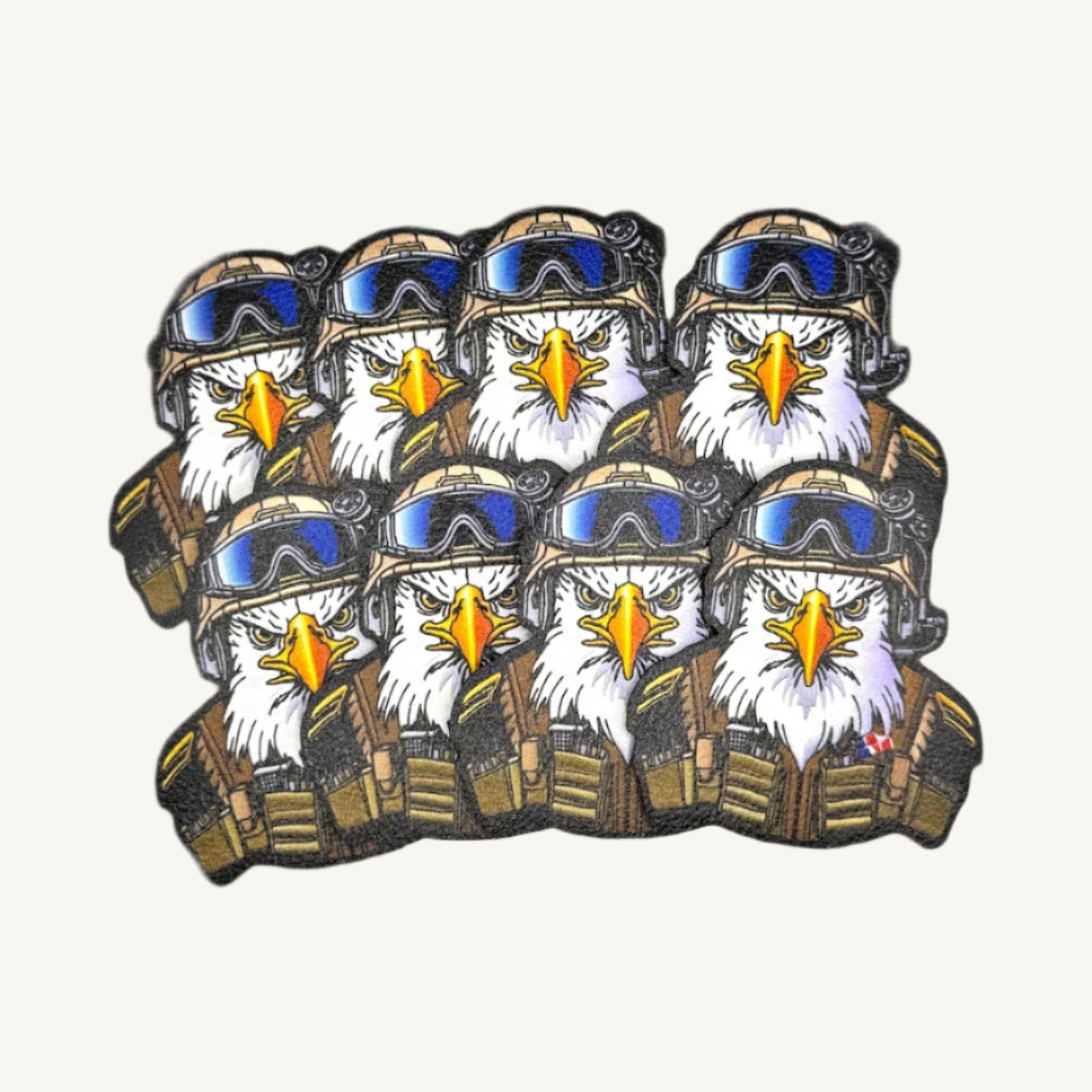 Multiple patches with a UV printed design of a bald eagle wearing a military helmet.