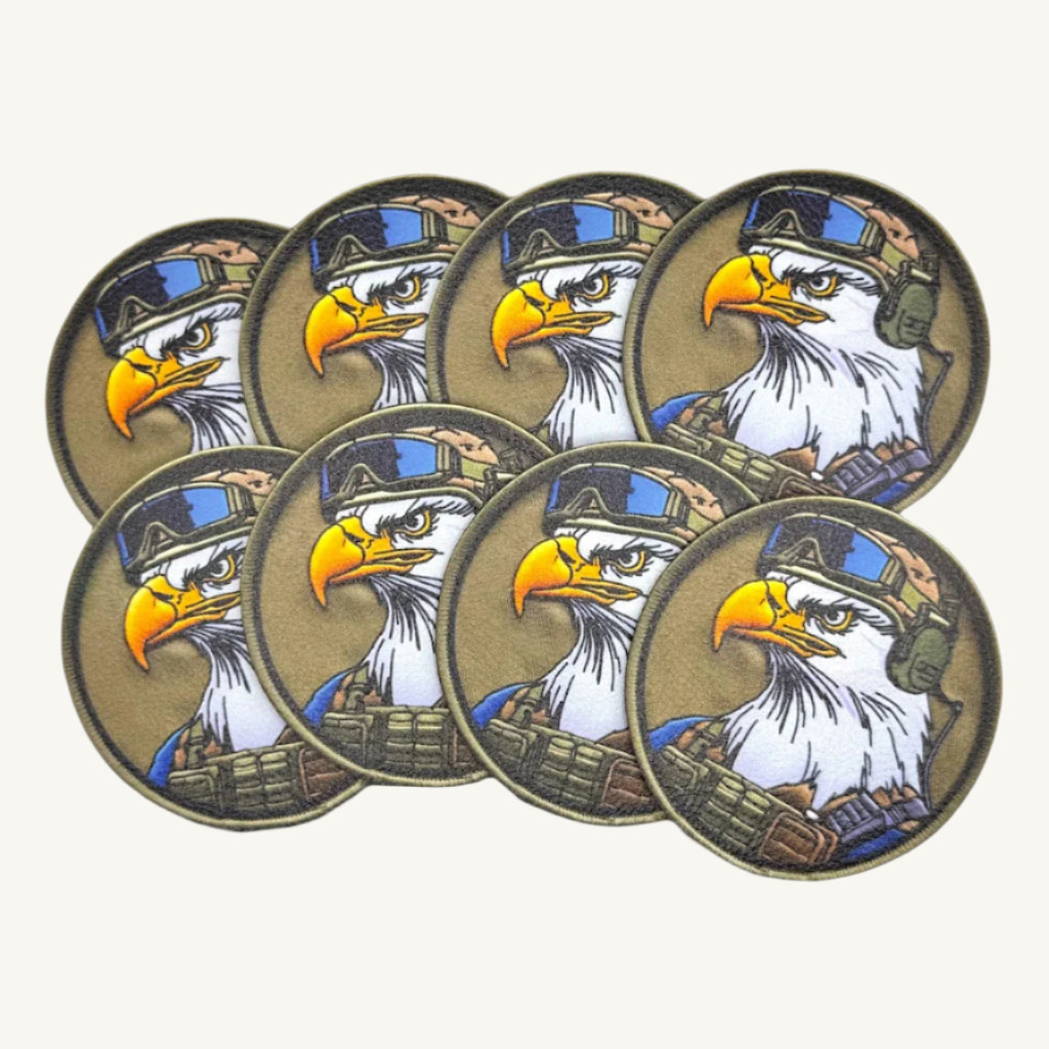 Multiple circular patches with a UV printed design of a bald eagle wearing a military helmet.