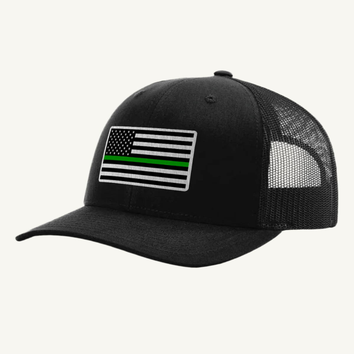 A black trucker hat with an acrylic patch on the front displaying the Thin Green Line American Flag.