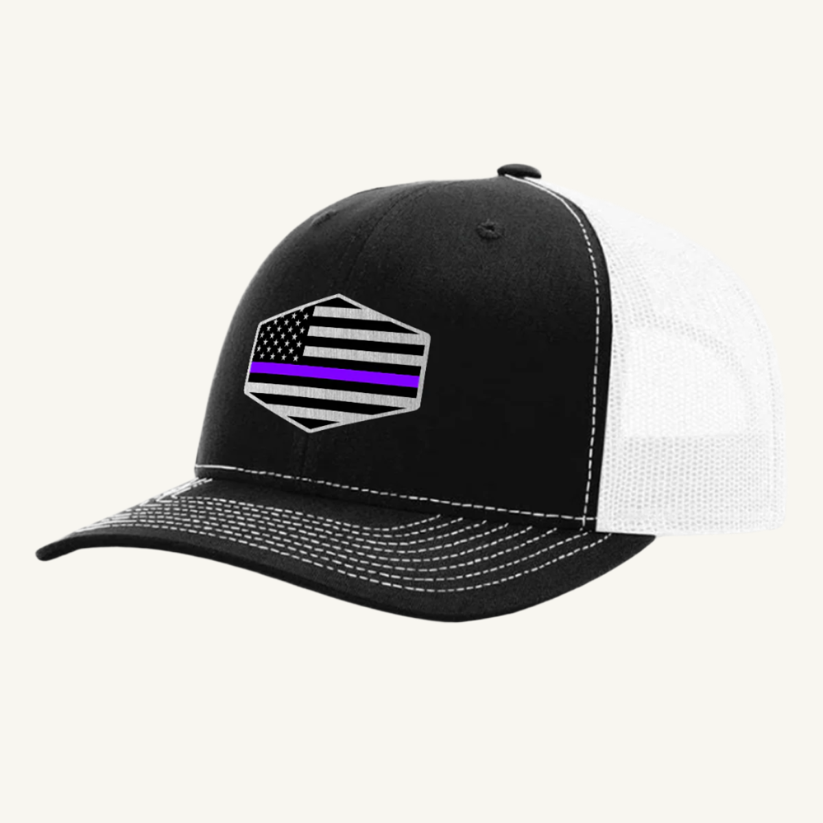 A black and white trucker hat with an acrylic patch on the front featuring the Thin Purple Line American Flag.