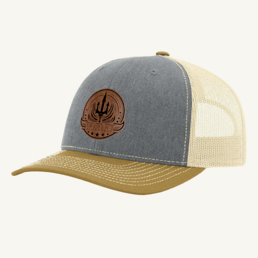 A custom branded leatherette patch hat with a beige mesh back and a branded patch on the front, primarily in a gray color.