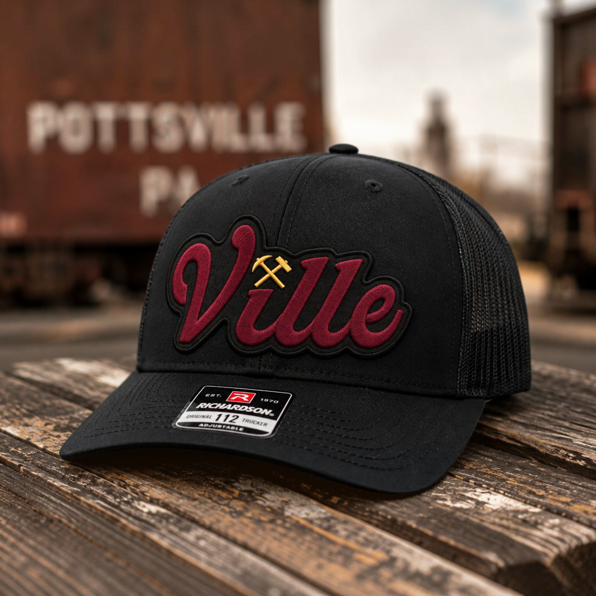 Pottsville Ville Richardson 112 trucker hat with maroon leatherette patch and gold crossed mining tools